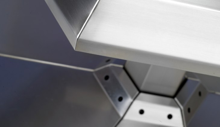 Custom stainless steel food grade display rack with cosmetically blended corner welds. Complete fabrication – laser cutting, forming, welding, surface finishing and weld blending.