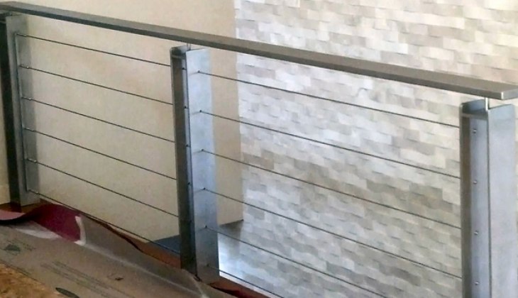 Custom railing constructed of steel with stainless wires. Complete fabrication including design, surface finishing and installation.