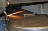 Laser cutting of pre-stamped sheet metal housing
