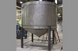 Steel tank with external cooling jackets. Complete fabrication with cutting, forming and welding.